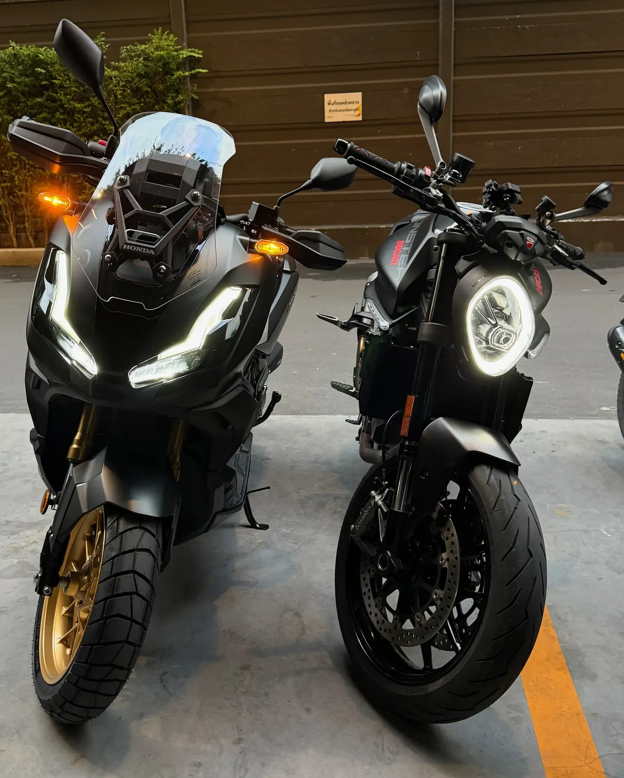 Ducati Monster and Honda ADV350 photographed together in Bangkok
